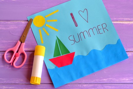 Paper card with ship, sun, sea. I love summer. Kids summer camp idea for crafts and activity. Inspiration for children of all ages. Paper art children project. Scissors, glue stick. Wooden backgroundの写真素材