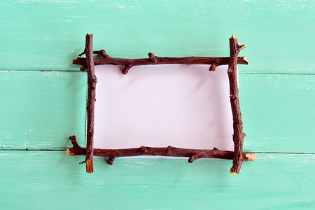 Frame made of branches. Frame with empty place for text. Frame for postcardsの写真素材