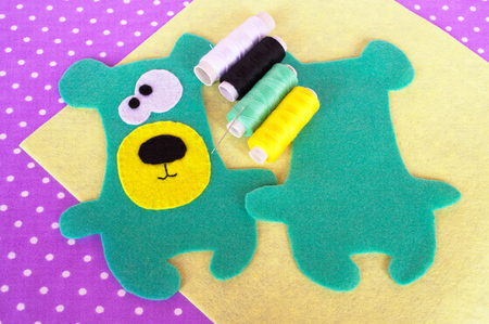 Handmade felt green bear setの写真素材