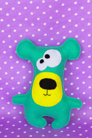 Handmade felt green bear toyの写真素材