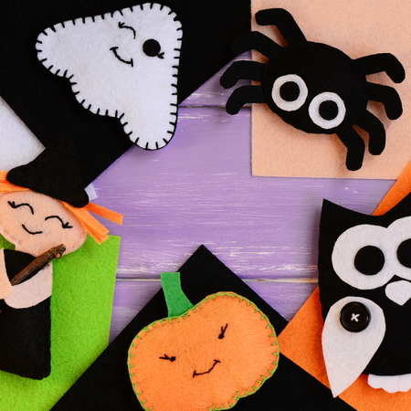 Halloween crafts made of felt. Felt witch, ghost, owl, spider, pumpkin decorations. Felt Halloween handmade decorations set. Sewing idea for adults and kids. Top viewの写真素材