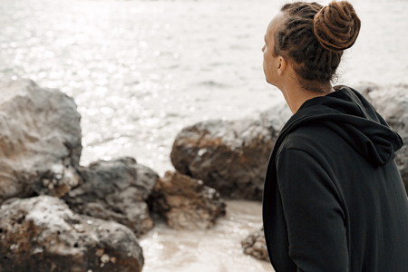 close up of handsome hippie styled man outdoors at sunsetの写真素材