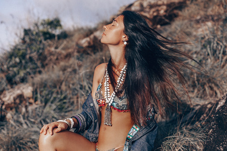 young woman in bikini outdoors portrait at sunset