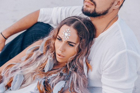 beautiful young couple on the beach at sunset. love and relationships conceptの写真素材