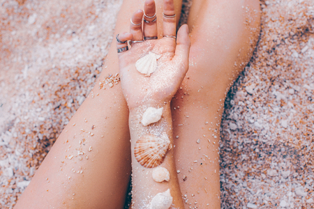 sea shells on woman hand design conceptの写真素材