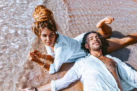 close up of beautiful young couple having fun at the beach