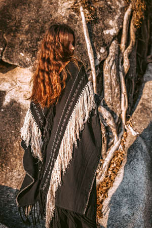 Beautiful young stylish woman outdoor at sunset.の写真素材