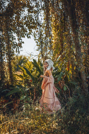 beautiful young stylish wuman wearing turban outdoorsの写真素材