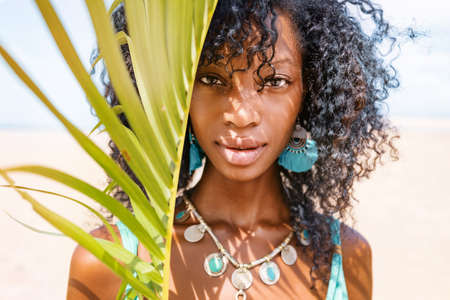 Beautiful young stylish woman sunny day portrait at the beachの写真素材