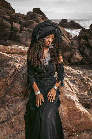 beautiful young tribal woman with wearing turban outdoorsの写真素材