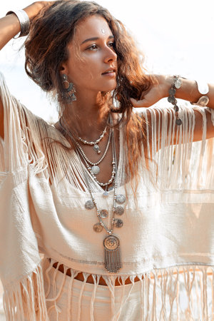 beautiful young stylish woman on the beach