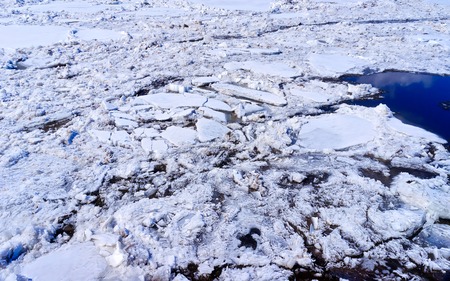Small floes floating on the surface of the water.