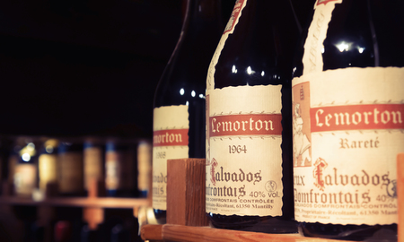 HONFLEUR, FRANCE, AUGUST 27, 2012: Bottles on the shelf in a private wine cellar.のeditorial素材