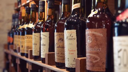 HONFLEUR, FRANCE, AUGUST 27, 2012: Bottles on the shelf in a private wine cellar.のeditorial素材