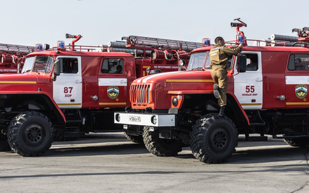 KHABAROVSK, RUSSIA, JULY 31, 2014: The firefighter is checking his equipment.のeditorial素材