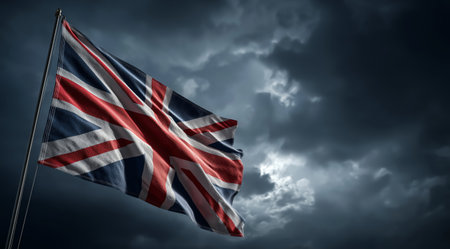 The British flag flutters against a blue sky with white clouds. Generative AIの素材