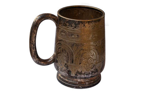 Old silver mug isolated. Shaded silver. Texture of silver sulfate on the surface of the cup.