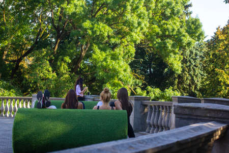Young people are resting in the park.の写真素材