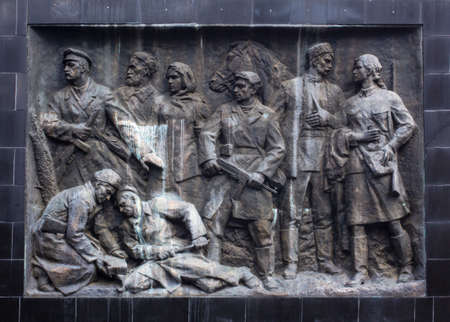 A sculptural composition in the style of socialist realism. A bas-relief of the times of the USSR on the theme of the Second World War.のeditorial素材