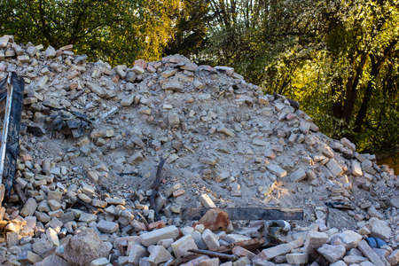 Ruins of an old house. A pile of old bricks after dismantling an old house.