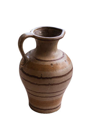 A small ceramic jug with horizontal stripes isolated on a white background. handle side viewの写真素材