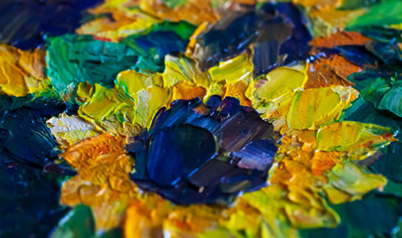 Smears of oil paints made with a palette knife. Sunflower painted with oil paints