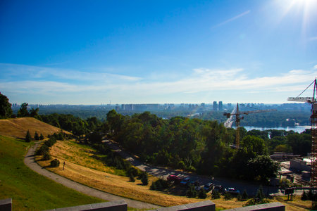 View of the left-bank Kyiv across the Dnieper. construction cranesの写真素材