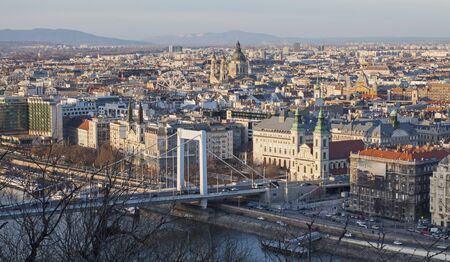 Elisabeth bridge and St. Stephen basilica in Budapest â February 23, 2019; Panoramic view of Budapest with Elisabeth bridge and St. Stephen basilica in sunset.のeditorial素材