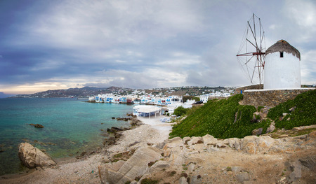 Mykonos town and famous windmill on a cloudy day, Greeceの写真素材