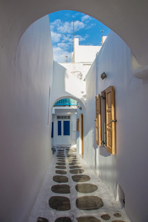 Mykonos streetview with arch and blue sky, Greeceの写真素材