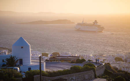 Sunset at Mykonos with windmills and cruise ship, Greeceの写真素材