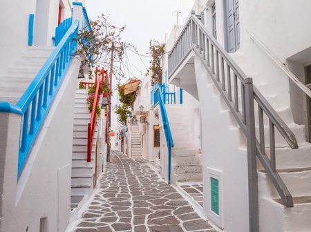 Mykonos town streetview with stairs and blue and grey and red banisters, Greeceの写真素材