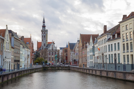 Canal of Bruges with Church, Belgiumの写真素材