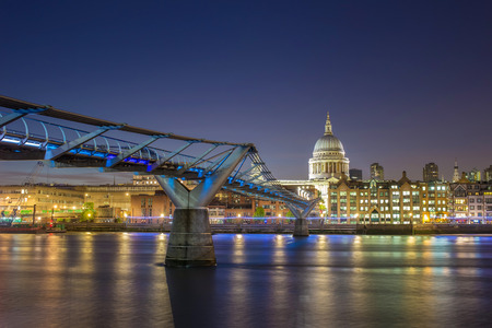 St Paul's Cathedral and the Millennium Bridge by night, London, UKの写真素材