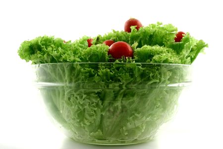 Green fresh iceberg lettuce with radish put in a bowlの写真素材