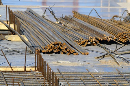 View at heavy steel bars lying on a construction siteの写真素材