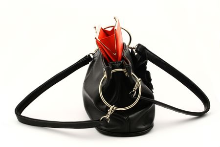 View at red wallet put in a black handbag on a white backgroundの写真素材