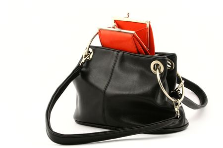 View at open empty red wallet put in a black handbag on a white backgroundの写真素材