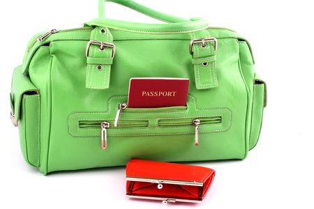 View at green handbag with passport in a pocket and red walletの写真素材