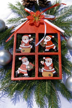 Red house with santaclauses as a christmas decorationの写真素材