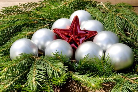 Red star in a centre of a christmas balls triangleの写真素材