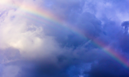Rainbow among the storm clouds.Background.Soft focus.の写真素材