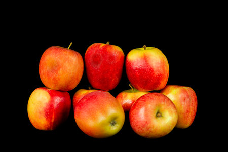 A bunch of apples on black backgroundの写真素材