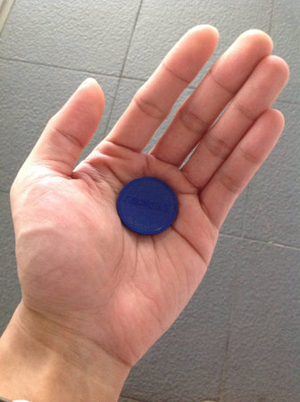Rapid KL LRT token in male hand