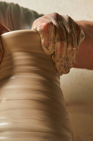 Craftsman molding a clay vaseの写真素材