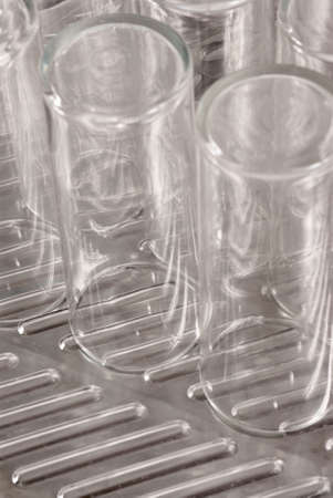 several soap covered glasses in a sinkの写真素材