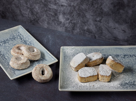 Donuts and sugar-coated almond cakesの写真素材