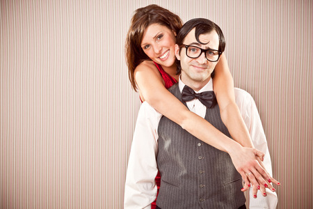 nerd boyfriend man and beautiful woman couple in love close portrait for Valentine Day