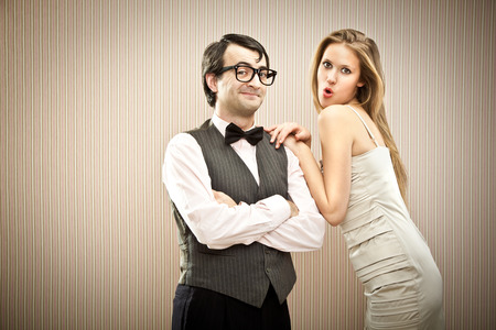 Nerd man boyfriend courts his love girlfriendの写真素材