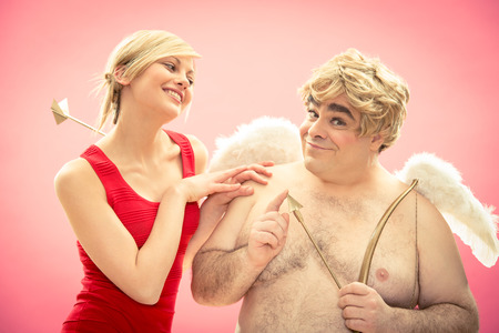 Cupid with his new love girlfriend got by arrow for valentine dayの写真素材